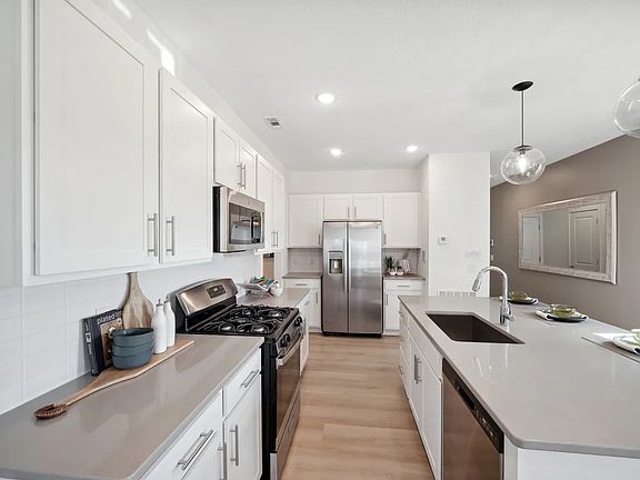 Kitchen with island and pendant lighting