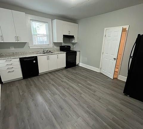 Kitchen with bathroom to the right