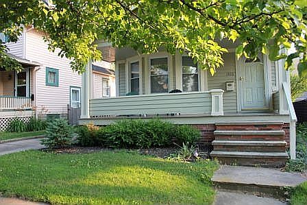 Boxwood shrubs, brick porch