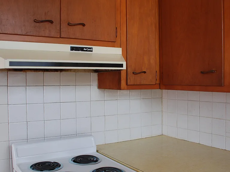 Kitchen stove and cabinets.