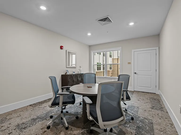 Active Adult conference room with a round table and chairs