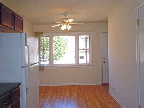 Eat-In Area with Great Natural and Artificial Lighting and Hardwood Floors
