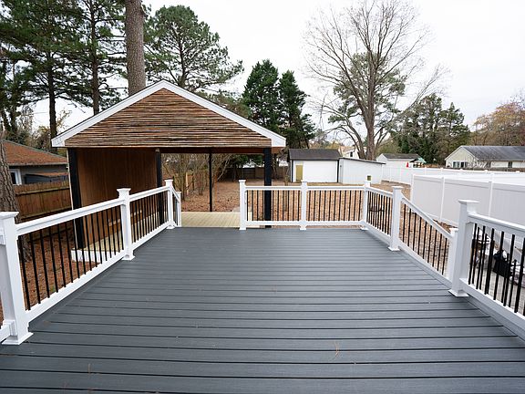 Huge fenced in back yard with gazebo and large workshop in the back