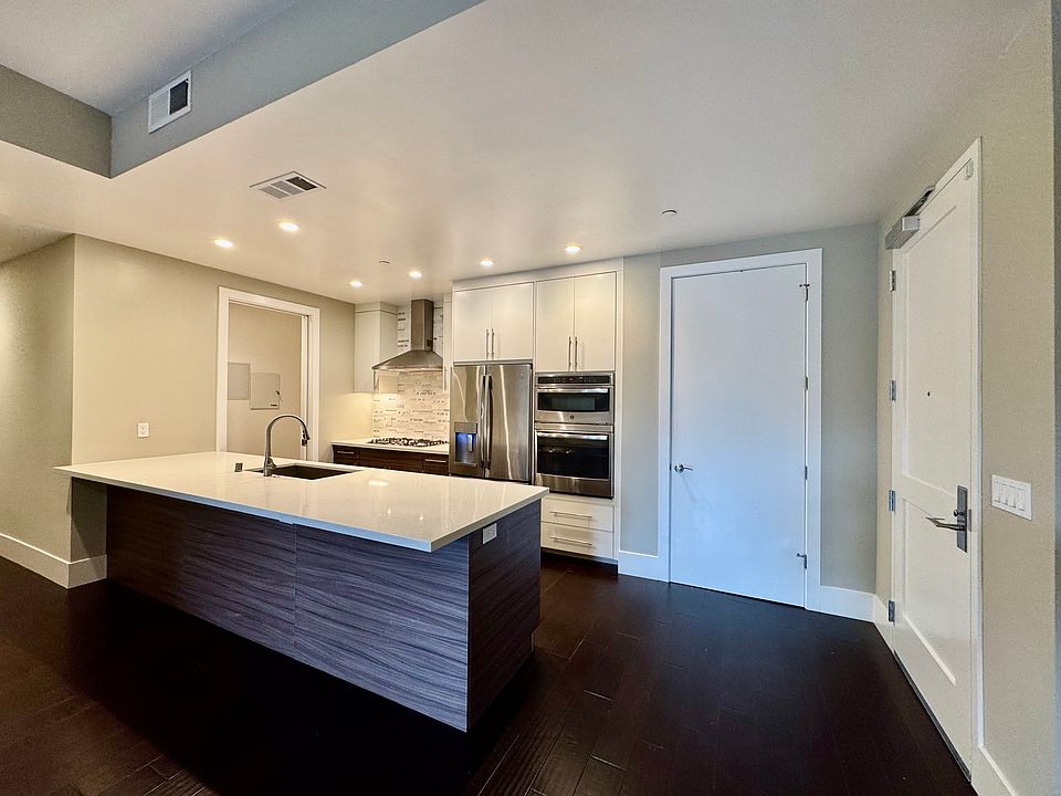 Kitchen (with Coat Closet on Right and Laundry/Pantry Space on Left)