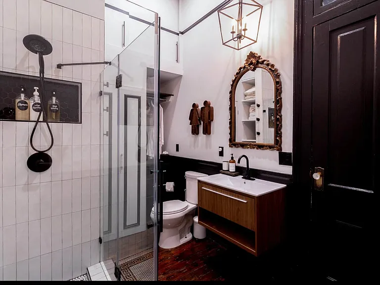 Fully- equipped, modern bathroom with tons of storage and room for hanging clothes and drawers