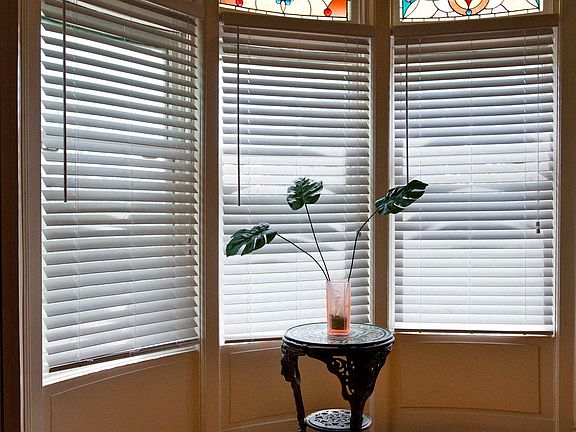 Bay window with original stained glass windows - Master bedroom
