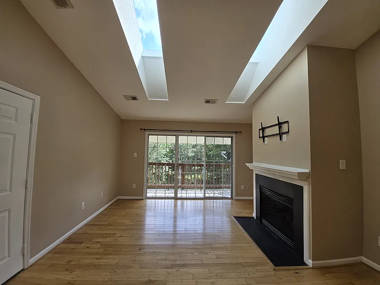 Living room opens up to covered back deck