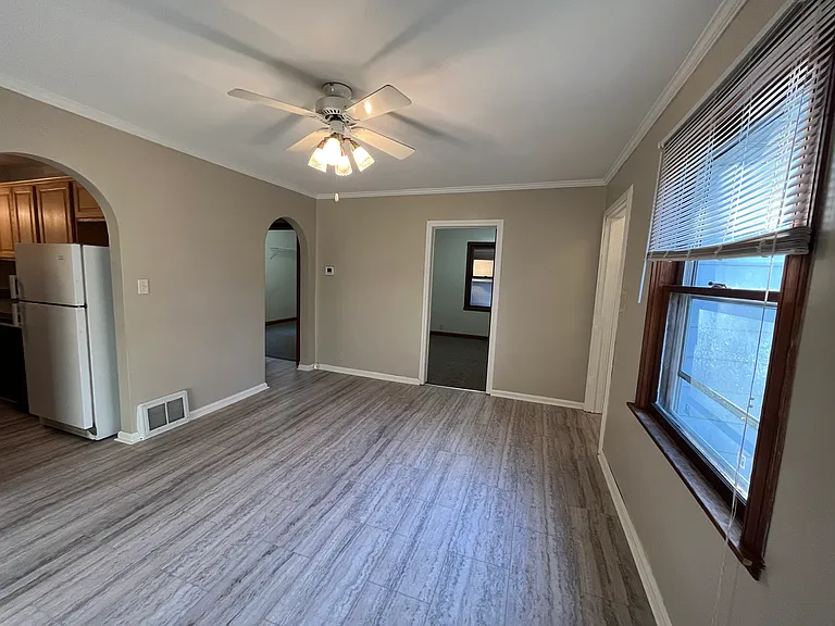 Dining area
Bedroom straight ahead, kitchen to the left, other bedroom and bathroom off of the back left arched doorway