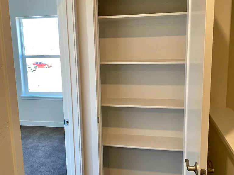 Upstairs storage closet. Master Bedroom to the left