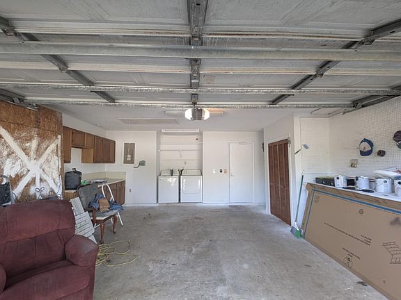 Two car garage with a work bench. Washer and dryer included with rental