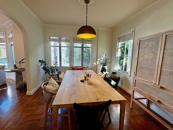 More sunny windows with views of trees in the dining room.
