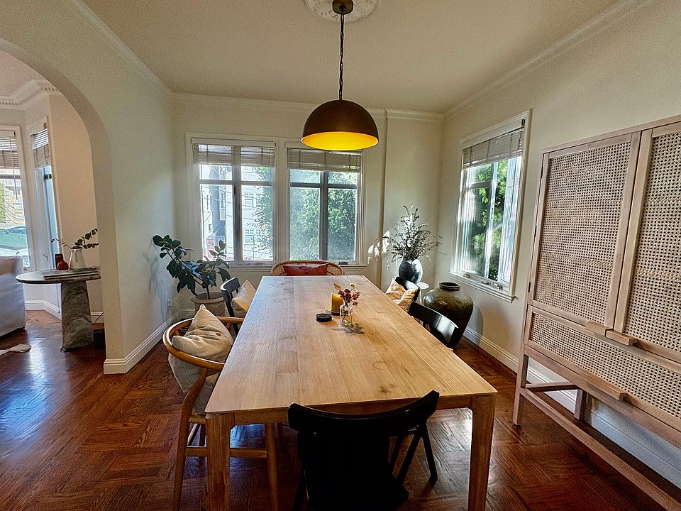 More sunny windows with views of trees in the dining room.