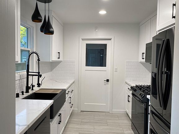 Kitchen leading to laundry, 1/2 bath , and garage