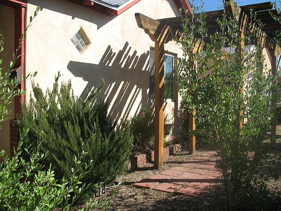 Front yard - landscaped with front patio area for seating