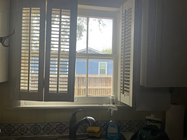 window with shutters at kitchen sink