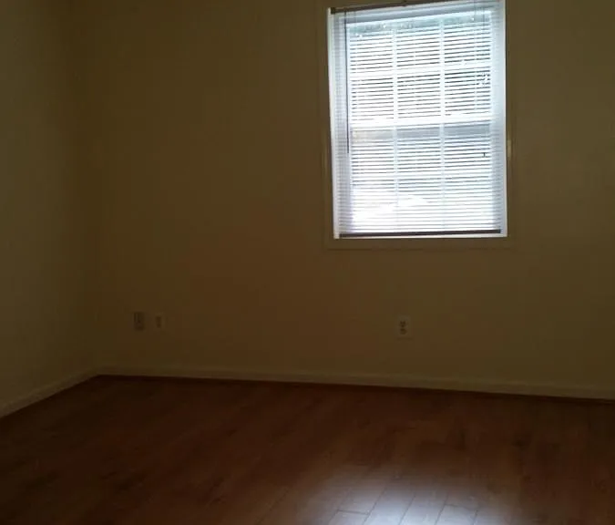 Master Bedroom with nice wood flooring