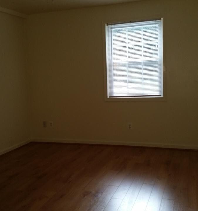 Master Bedroom with nice wood flooring