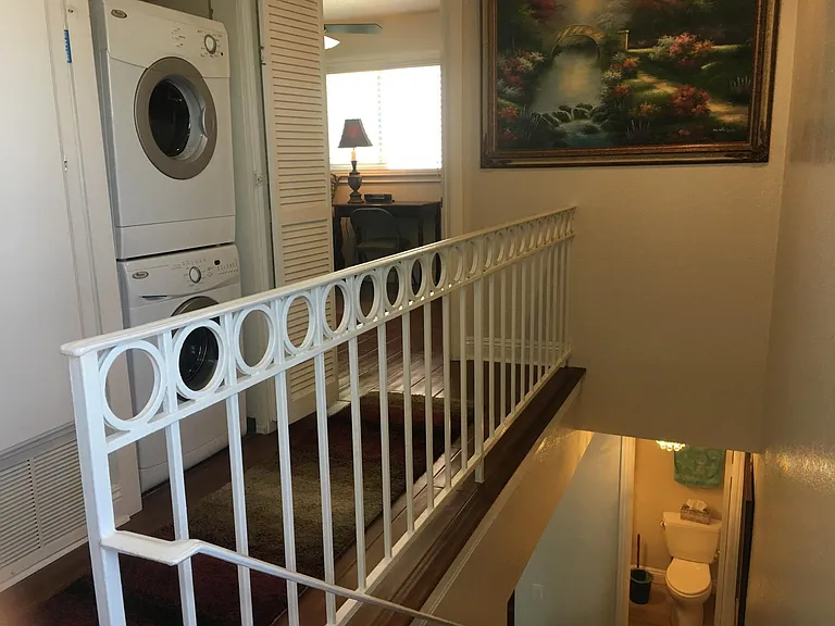 Washer and Dryer & Your cozy FURNISHED bedroom to the left of the painting.