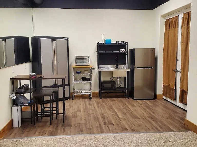 Kitchenette area with dining table.