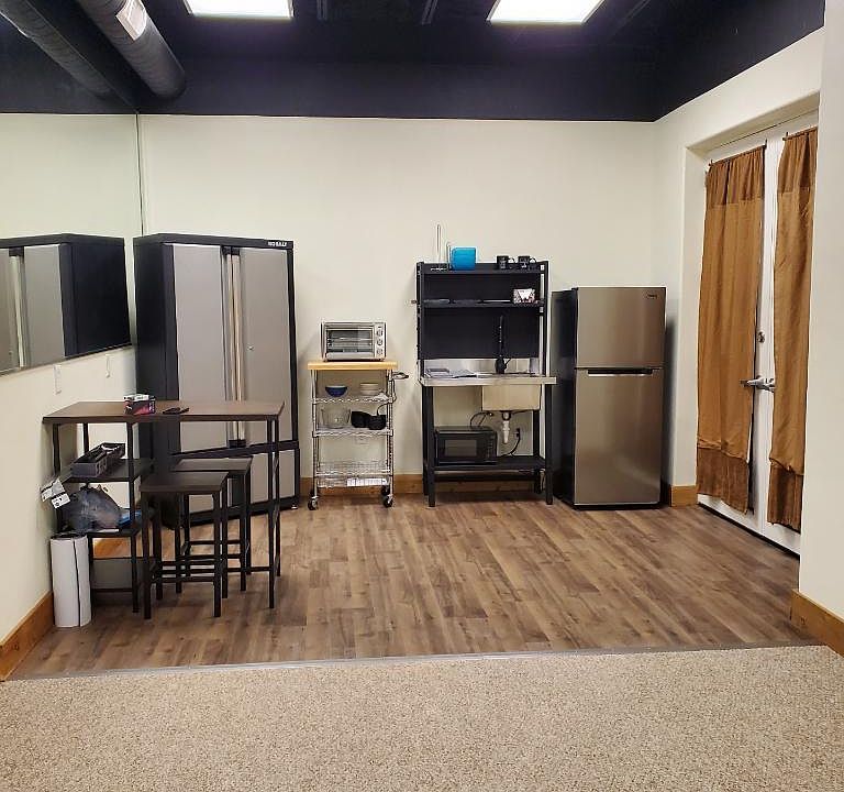 Kitchenette area with dining table.