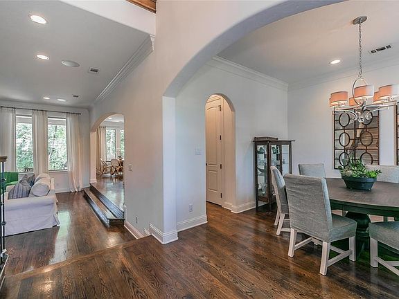 Soaring Ceilings welcome you at the front door into this beautifully maintained home.