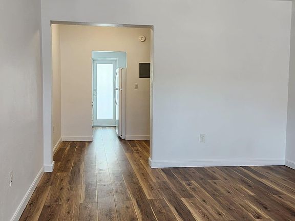 Living area, nook, and kitchen to balcony