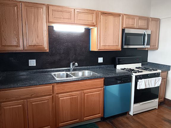 New: Cabinets, Counter, Microwave, Dishwasher, Paint.