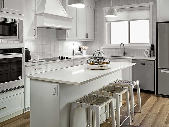 A photo of the kitchen in the Alder duplex model by Brookfield Residential