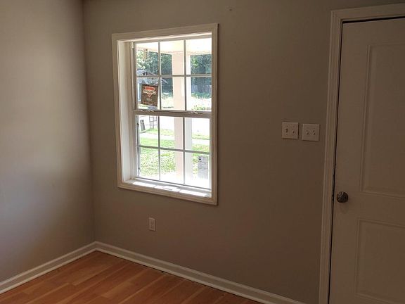 Updated flooring and new paint throughout - Living room