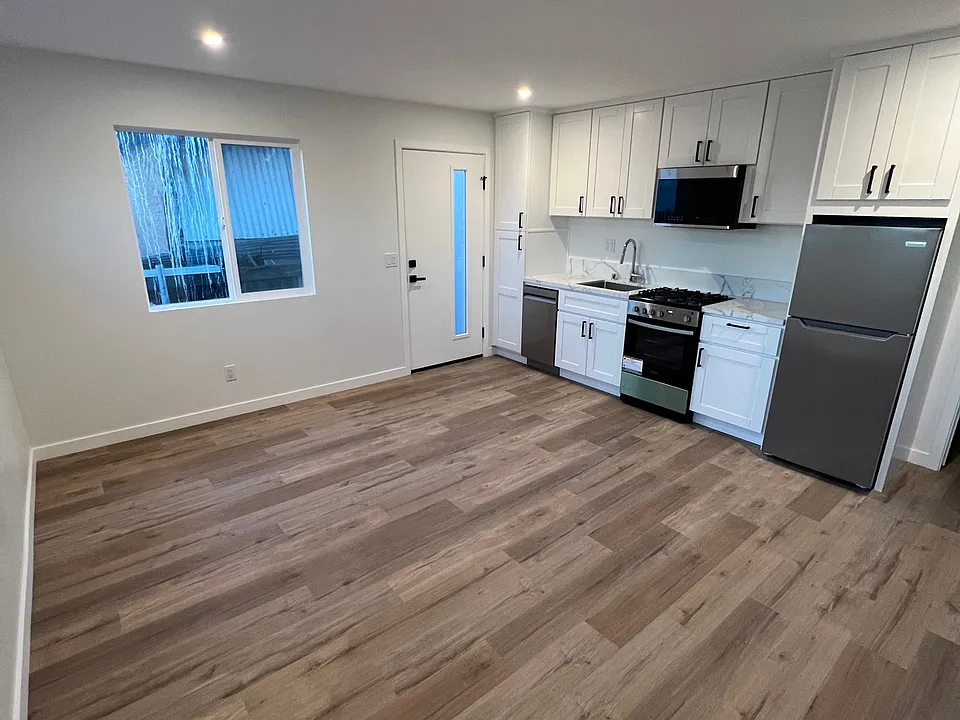 Living Room and Kitchen with KitchenAid appliances.