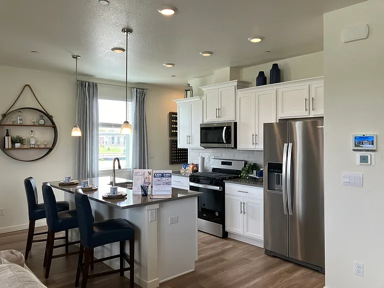 Sample of same floor plan, different finishes, staged with furniture.