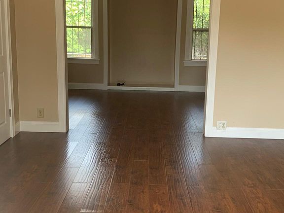Living room looking towards formal dining room. The living room has a large closet for added storage