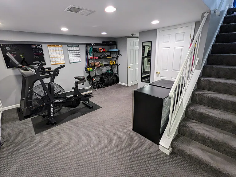 Basement common area serves as wonderful home gym or second living room.