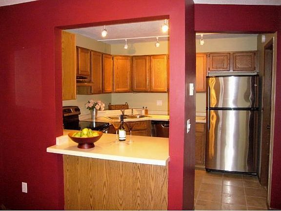 Updated kitchen with stainless steel appliances,travertine flooring, and a large walk-in pantry just off the refrigerator.