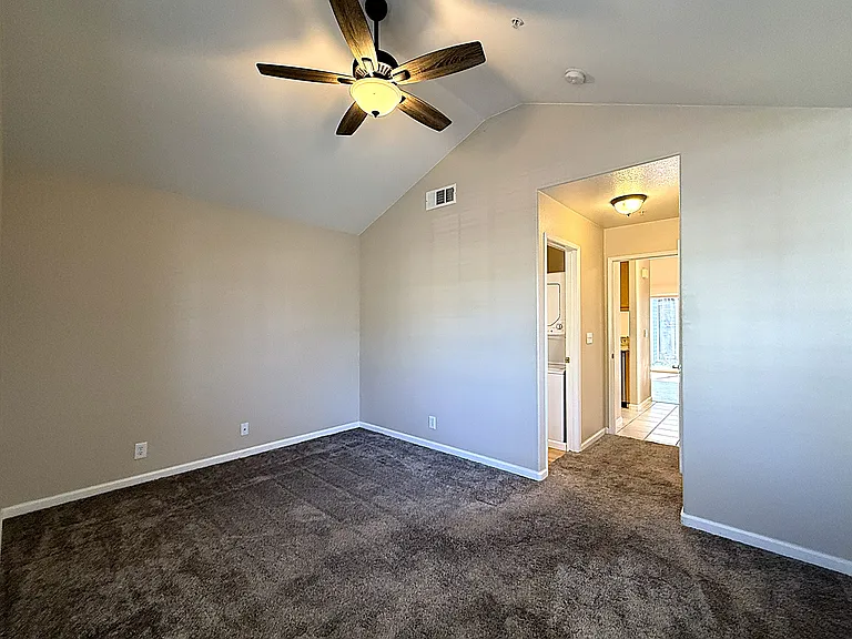 Guest Bedroom with Attached Half Bathroom & Laundry Area