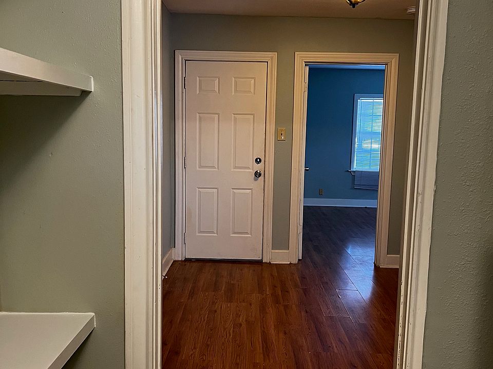 Front door entry, and dining room, as viewed from kitchen
