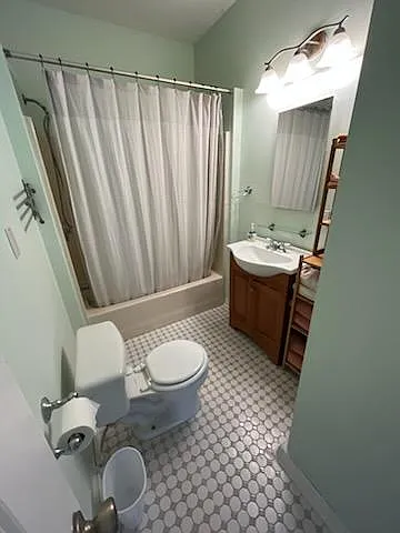 Renovated upstairs full bathroom, across the hall from first bedroom and next to second bedroom.
