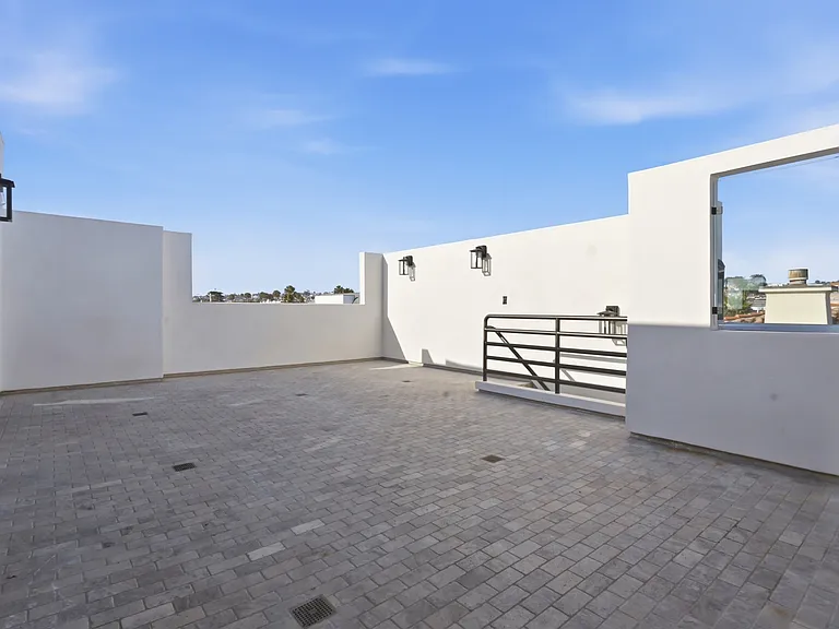 In the top of the third floor you will find a chef's kitchen with walk-in pantry, breakfast nook, 8-sit dining table, and rooftop patio with direct stair access to the street