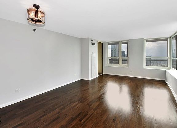 Gleaming hardwood floors throughout common area and combo living/dining room