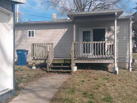 REAR OF HOUSE WITH NICE DECK