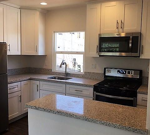 New kitchen with stainless steel appliances.