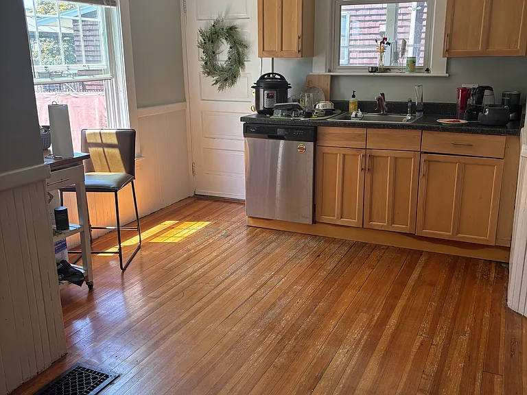kitchen with door to enclosed porch