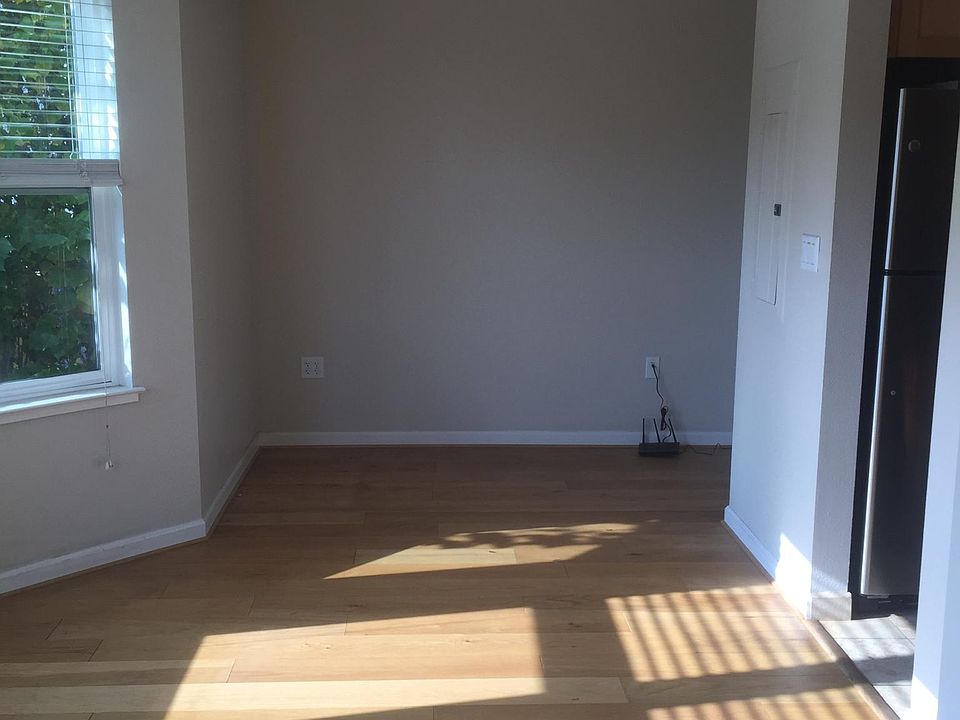 Living Room - Kitchen to the right and office nook with another window in the far right corner.