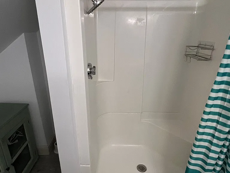 Shared bathroom shower.