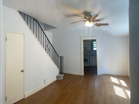 Dining room with cellar entry and kitchen in back.