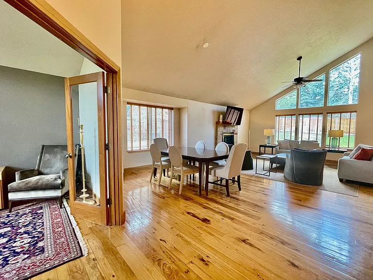 Entry way view with formal dining room and living room. Home office with glass doors to the left as you enter