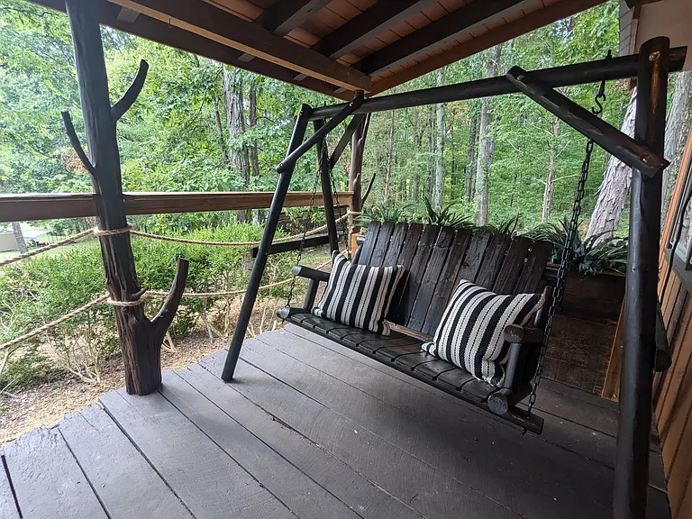 Rustic-style front porch swing