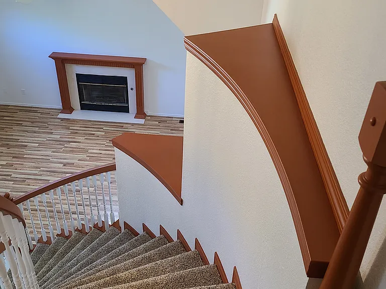 Spiral staircase and picture ledges