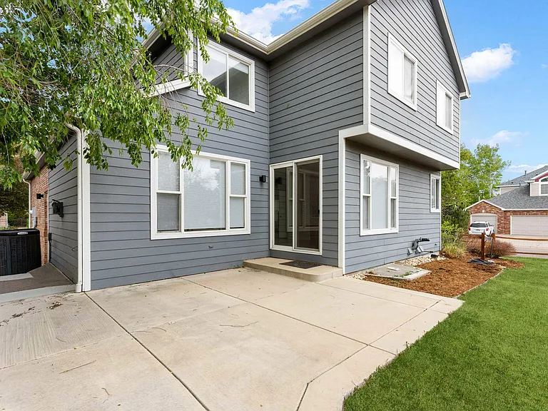 The spacious patio offers the perfect setting for outdoor dining, entertaining, or cozying up with a morning cup of coffee.