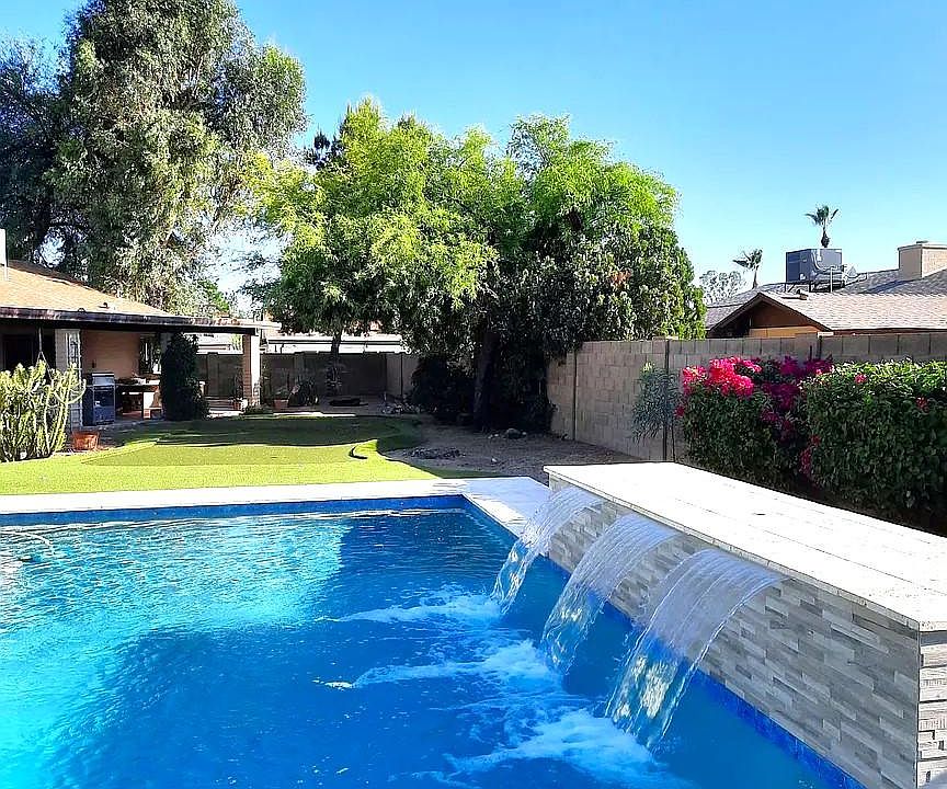 Heated pool with water feature
